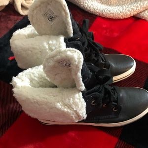 Woman black and white Keds boots in a size 10